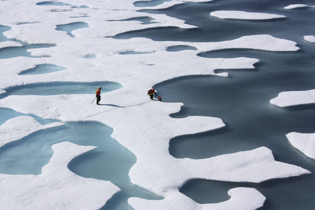FILE PHOTO: The crew of the U.S. Coast Guard Cutter Healy, in the midst of their ICESCAPE mission, retrieves supplies in the Arctic Ocean in this July 12, 2011 NASA handout photo. Kathryn Hansen/NASA via REUTERS/File Photo ATTENTION EDITORS - THIS IMAGE WAS PROVIDED BY A THIRD PARTY. EDITORIAL USE ONLY. NO RESALES. NO ARCHIVE.