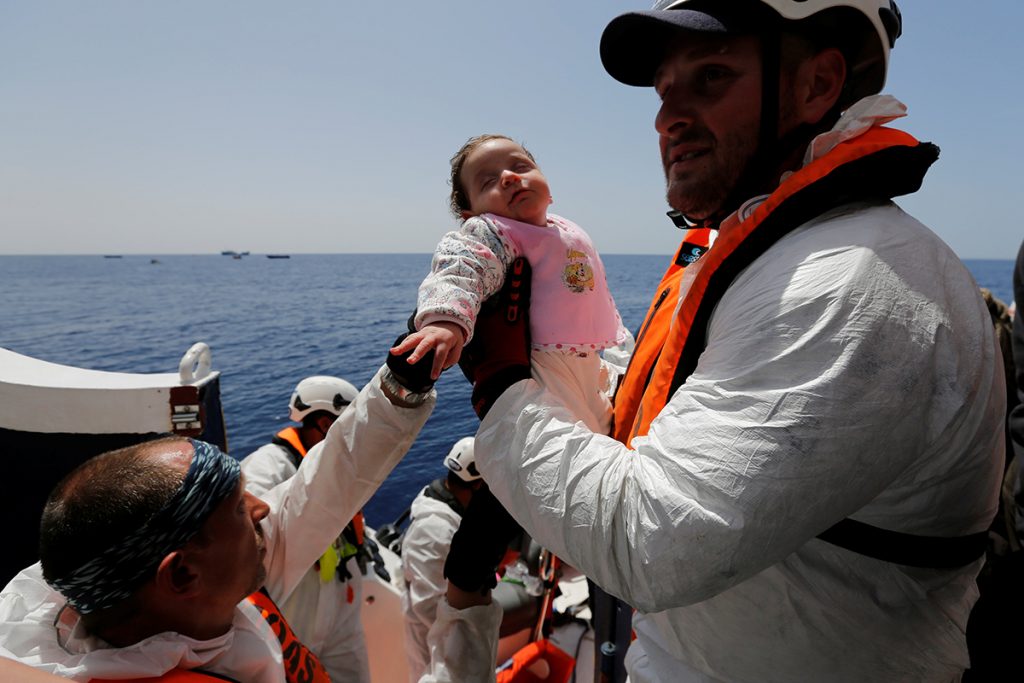 A baby migrant is brought onto the Malta-based NGO Migrant Offshore Aid Station (MOAS) ship Phoenix during a rescue operation in the central Mediterranean, in international waters off the Libyan coastal town of Sabratha, May 4, 2017. REUTERS/Darrin Zammit Lupi TPX IMAGES OF THE DAY