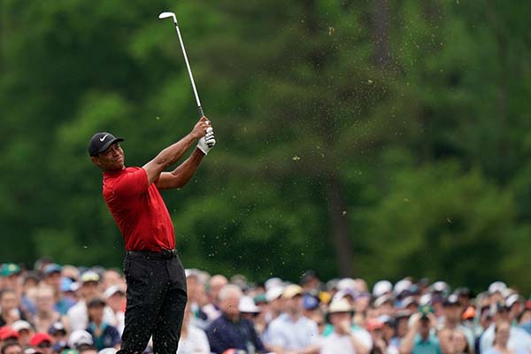 Woods firmó una tarjeta con 70, para un global de 275 (-13), uno menos que sus compatriotas Dustin Johnson (68), Xander Schauffele (68) y Brooks Koepka (67), 276 (-12). FOTO: AFP